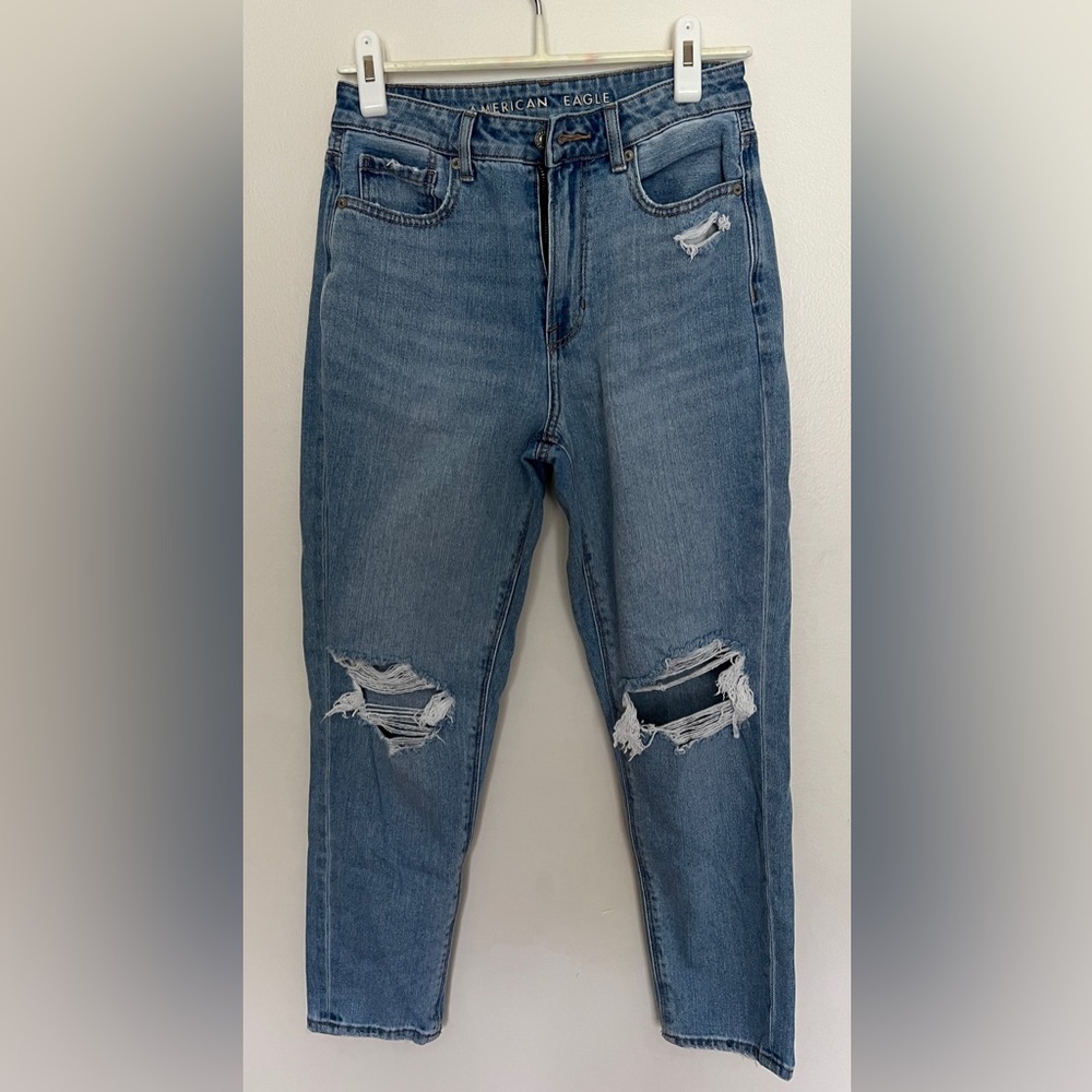 Women’s distressed blue jeans